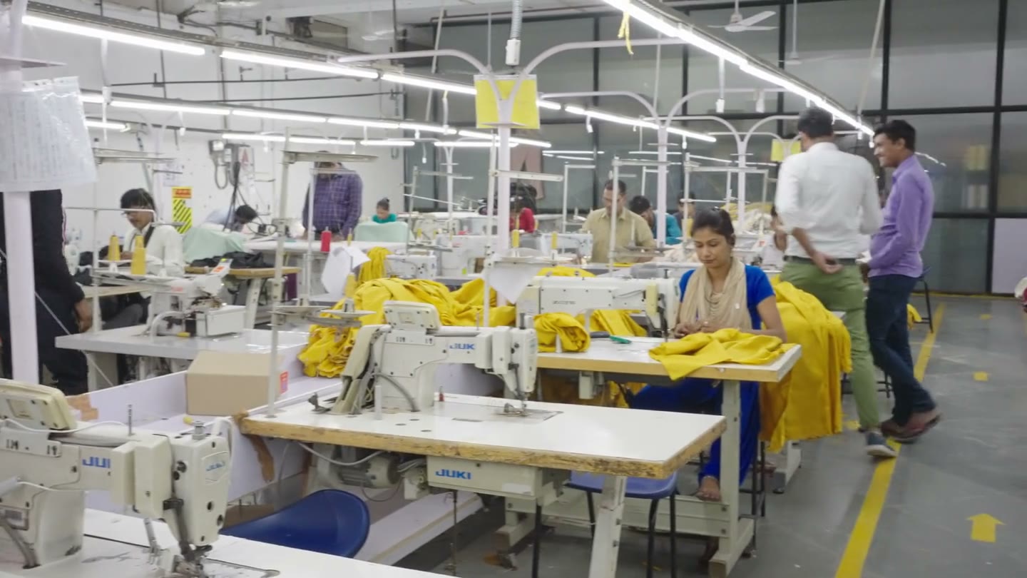 Garment operators sewing with industrial machines